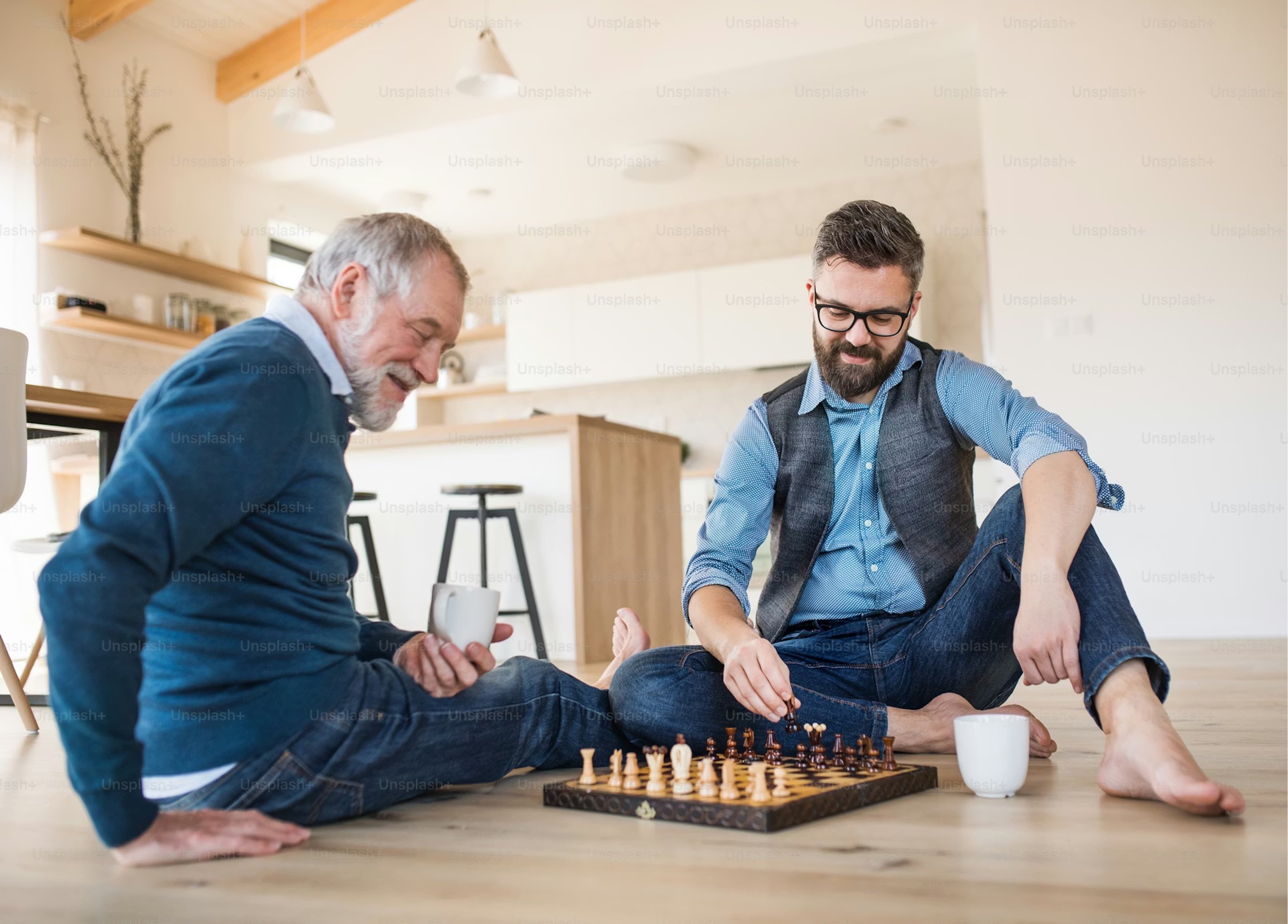 A father and son sharing a quiet moment over a chess game